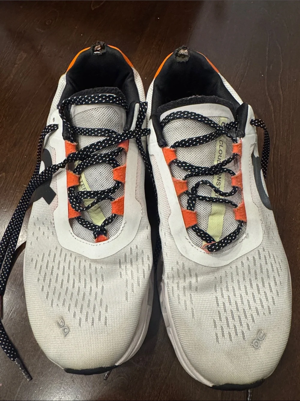 On Running Women’s White and Orange Lace-Up Sneakers